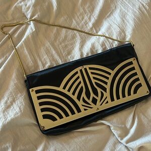 Never used satin and gold metal bag